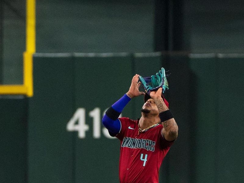 Apr 14, 2024; Phoenix, Arizona, USA; Arizona Diamondbacks infielder Ketel Marte (4) catches a pop-fly in the during fifth inning against the St. Louis Cardinals at Chase Field. Mandatory Credit: Allan Henry-USA TODAY Sports