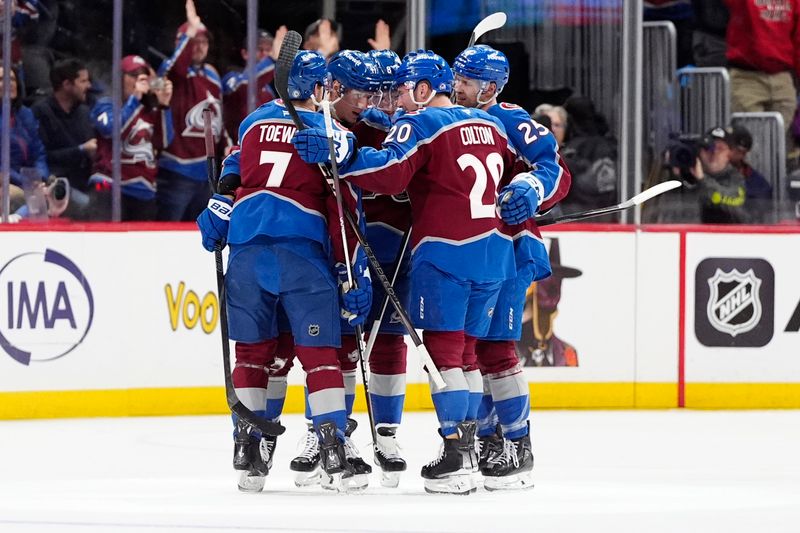 Jan 14, 2025; Denver, Colorado, USA; Colorado Avalanche center Parker Kelly (17) celebrates his goal with defenseman Devon Toews (7),defenseman Cale Makar (8),right wing Logan O'Connor (25) and right wing Logan O'Connor (25) in the first period against the New York Rangers at Ball Arena. Mandatory Credit: Ron Chenoy Imagn Images