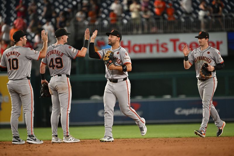 Aug 5, 2024; Washington, District of Columbia, USA; San Francisco Giants shortstop Casey Schmitt (10), center fielder Tyler Fitzgerald (49), left fielder Michael Conforto (8) and right fielder Mike Yastrzemski (5) celebrate after defeating the Washington Nationals at Nationals Park. Mandatory Credit: Rafael Suanes-USA TODAY Sports