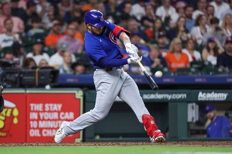 May 17, 2023; Houston, Texas, USA; Chicago Cubs right fielder Seiya Suzuki (27) hits a home run during the third inning against the Houston Astros at Minute Maid Park. Mandatory Credit: Troy Taormina-USA TODAY Sports