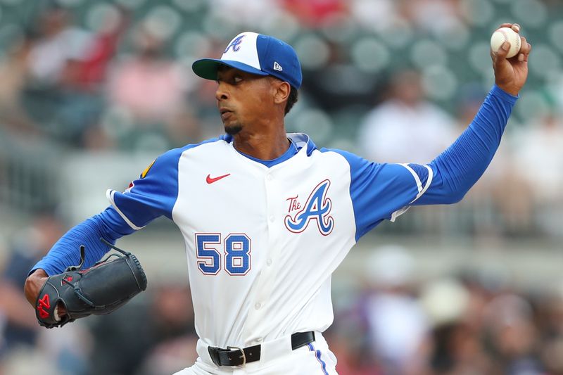 Jun 15, 2024; Cumberland, Georgia, USA; Atlanta Braves relief pitcher Ray Kerr (58) pitches against the Tampa Bay Rays during the ninth inning at Truist Park. Mandatory Credit: Mady Mertens-USA TODAY Sports