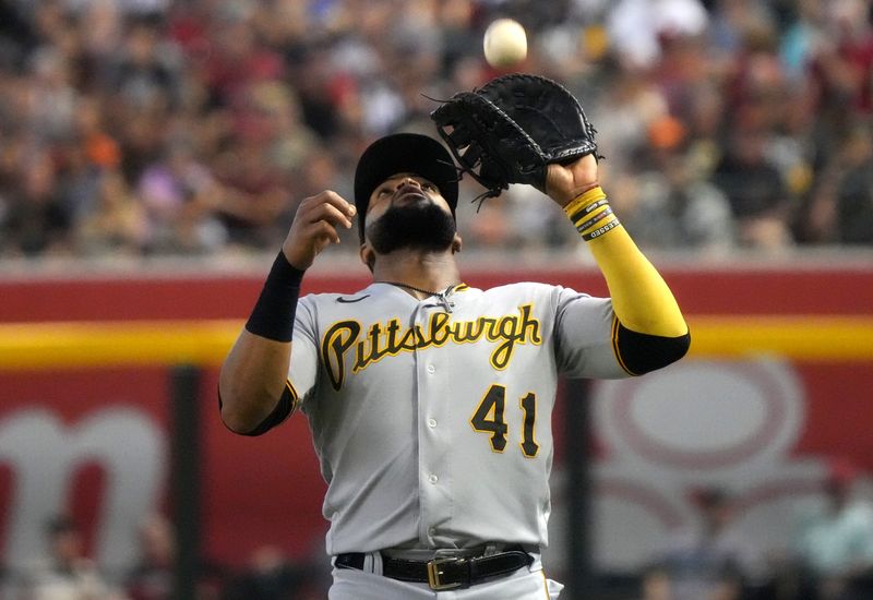 Jul 9, 2023; Phoenix, Arizona, USA;  Pittsburgh Pirates Carlos Santana (41) catches a pop fly ball at first base against the Arizona Diamondbacks at Chase Field. Mandatory Credit: Joe Rondone-USA TODAY Sports