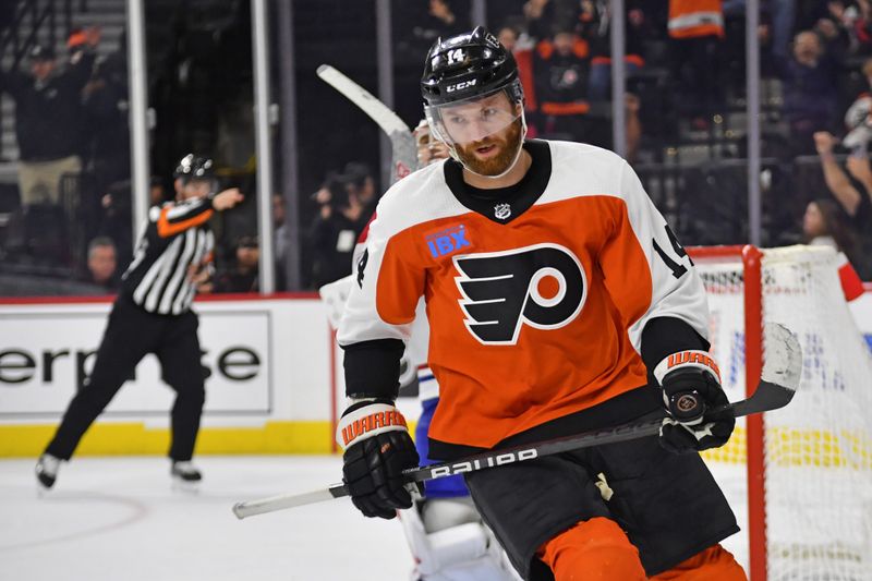 Jan 10, 2024; Philadelphia, Pennsylvania, USA; Philadelphia Flyers center Sean Couturier (14) celebrates his goal against the Montreal Canadiens during the shootout at Wells Fargo Center. Mandatory Credit: Eric Hartline-USA TODAY Sports