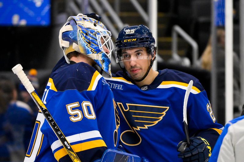 Nov 5, 2024; St. Louis, Missouri, USA;  St. Louis Blues goaltender Jordan Binnington (50) celebrates with center Jordan Kyrou (25) after the Blues defeated the Tampa Bay Lightning at Enterprise Center. Mandatory Credit: Jeff Curry-Imagn Images