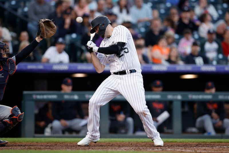 Jun 30, 2023; Denver, Colorado, USA; Colorado Rockies first baseman C.J. Cron (25) leans away from a pitch in the seventh inning against the Detroit Tigers at Coors Field. Mandatory Credit: Isaiah J. Downing-USA TODAY Sports