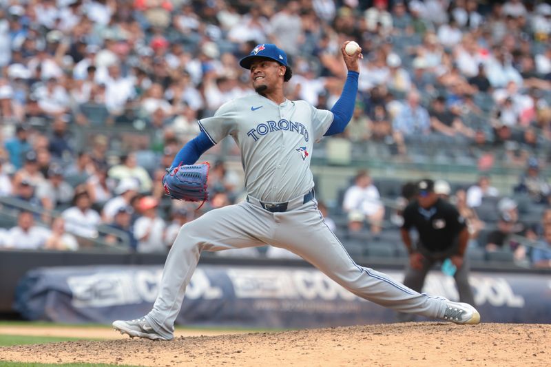 Aug 4, 2024; Bronx, New York, USA; Toronto Blue Jays relief pitcher Genesis Cabrera (92) delivers a pitch during the seventh inning against the New York Yankees at Yankee Stadium. Mandatory Credit: Vincent Carchietta-USA TODAY Sports