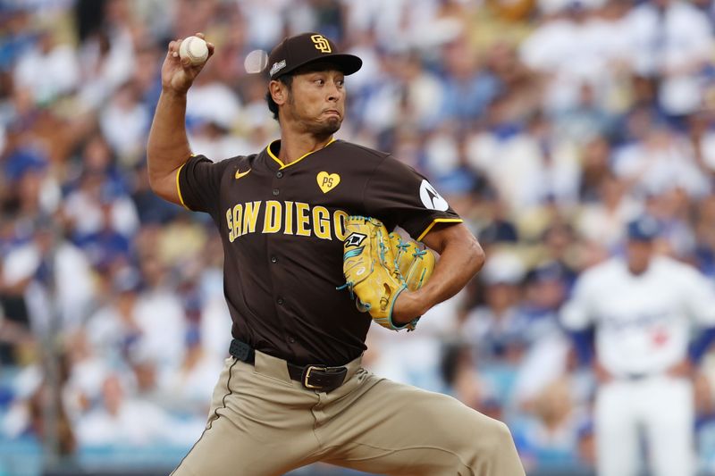 Oct 11, 2024; Los Angeles, California, USA; San Diego Padres pitcher Yu Darvish (11) pitches against the Los Angeles Dodgers in the first inning during game five of the NLDS for the 2024 MLB Playoffs at Dodger Stadium. Mandatory Credit: Kiyoshi Mio-Imagn Images