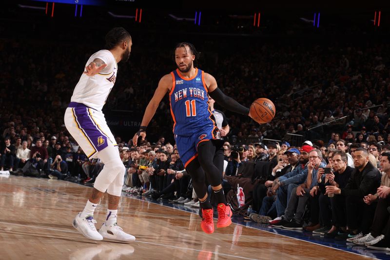 NEW YORK, NY - FEBRUARY 3: Jalen Brunson #11 of the New York Knicks handles the ball against D'Angelo Russell #1 of the Los Angeles Lakers during the game on February 3, 2024 at Madison Square Garden in New York City, New York.  NOTE TO USER: User expressly acknowledges and agrees that, by downloading and or using this photograph, User is consenting to the terms and conditions of the Getty Images License Agreement. Mandatory Copyright Notice: Copyright 2024 NBAE  (Photo by Nathaniel S. Butler/NBAE via Getty Images)