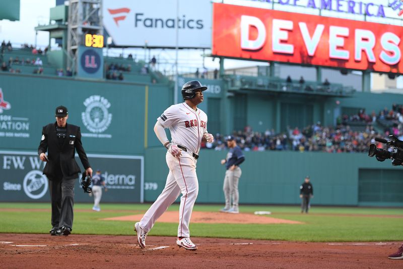 May 16, 2024; Boston, Massachusetts, USA;  Boston Red Sox third baseman Rafael Devers (11) crosses home plate after hitting a home run against the Tampa Bay Rays  during the second inning at Fenway Park. Mandatory Credit: Eric Canha-USA TODAY Sports