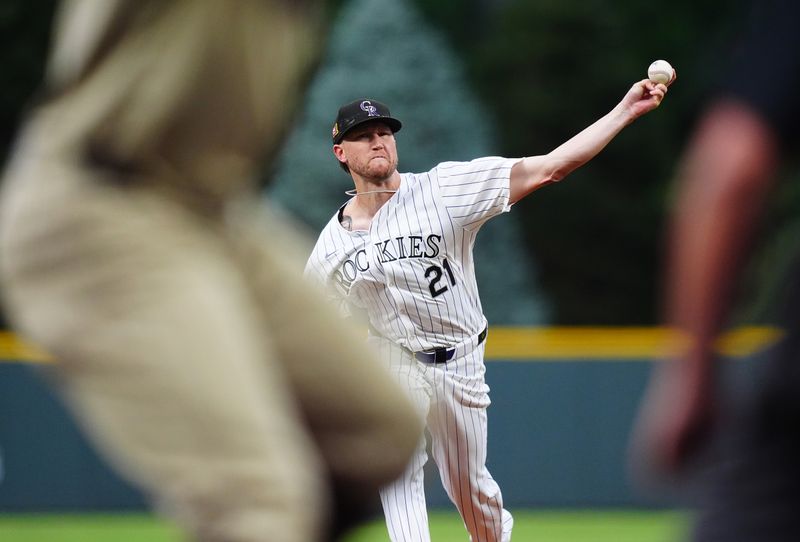 Aug 17, 2024; Denver, Colorado, USA; Colorado Rockies starting pitcher Kyle Freeland (21) delivers a pitch in the first inning against the San Diego Padres at Coors Field. Mandatory Credit: Ron Chenoy-USA TODAY Sports