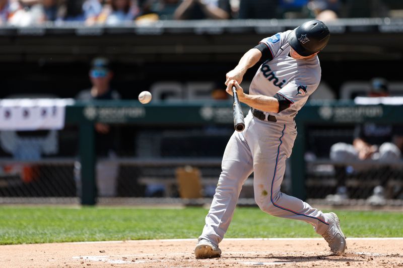 Jun 10, 2023; Chicago, Illinois, USA; Miami Marlins shortstop Joey Wendle (18) hits a single against the Chicago White Sox during the second inning at Guaranteed Rate Field. Mandatory Credit: Kamil Krzaczynski-USA TODAY Sports