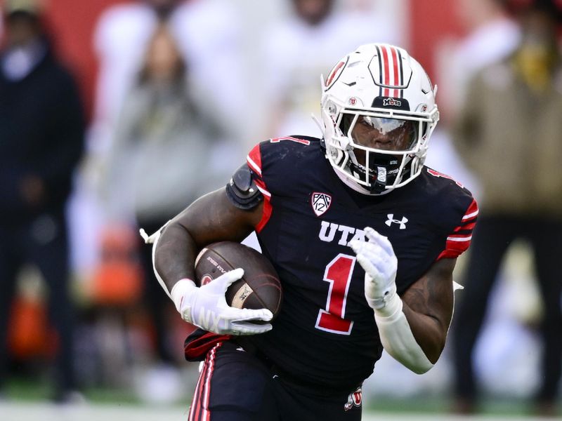 Nov 25, 2023; Salt Lake City, Utah, USA; Utah Utes running back Jaylon Glover (1) runs the ball downfield against the Colorado Buffaloes at Rice-Eccles Stadium. Mandatory Credit: Christopher Creveling-USA TODAY Sports