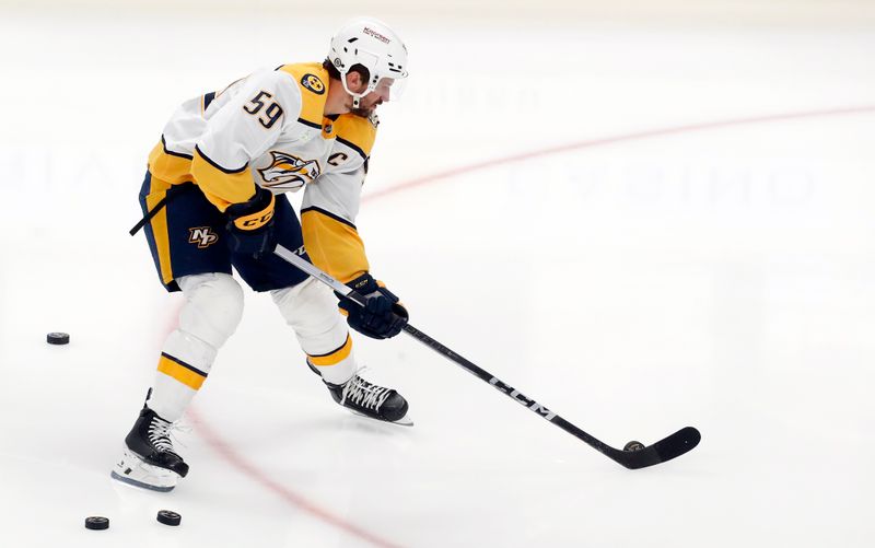 Apr 15, 2024; Pittsburgh, Pennsylvania, USA; Nashville Predators defenseman Roman Josi (59) warms up before the game against he Pittsburgh Penguins at PPG Paints Arena. Mandatory Credit: Charles LeClaire-USA TODAY Sports