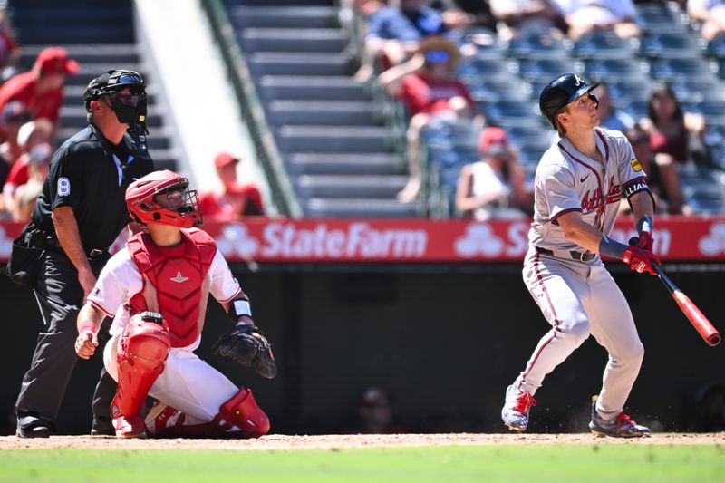 Aug 18, 2024; Anaheim, California, USA; Atlanta Braves outfielder Luke Williams (65) flies out against Los Angeles Angels catcher Matt Thaiss (21) during the X inning at Angel Stadium. Mandatory Credit: Jonathan Hui-USA TODAY Sports