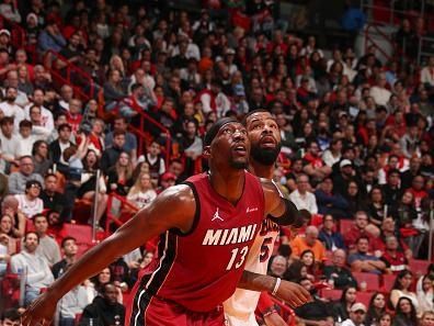 MIAMI, FL - DECEMBER 25:  Bam Adebayo #13 of the Miami Heat boxes out during the game  on December 25, 2023 at Kaseya Center Arena in Miami, Florida. NOTE TO USER: User expressly acknowledges and agrees that, by downloading and or using this Photograph, user is consenting to the terms and conditions of the Getty Images License Agreement. Mandatory Copyright Notice: Copyright 2023 NBAE (Photo by Issac Baldizon/NBAE via Getty Images)