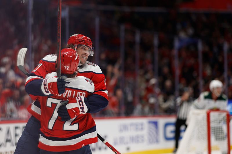 Oct 17, 2025; Washington, District of Columbia, USA; Washington Capitals center Dylan Strome (17) celebrates with Capitals left wing Anthony Beauvillier (72) after scoring a goal Minnesota Wild during the third period at Capital One Arena. Mandatory Credit: Geoff Burke-Imagn Images