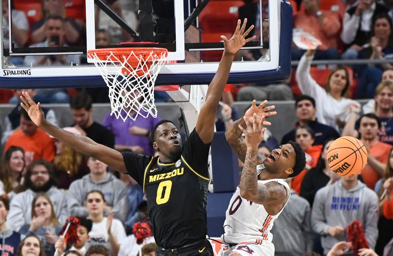 Feb 14, 2023; Auburn, Alabama, USA; Missouri Tigers forward Mohamed Diarra (0) knocks the ball away from Auburn Tigers guard K.D. Johnson (0) during the first half at Neville Arena. Mandatory Credit: Julie Bennett-USA TODAY Sports