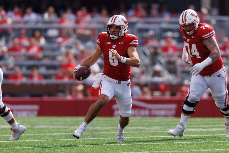 Sep 2, 2023; Madison, Wisconsin, USA;  Wisconsin Badgers quarterback Tanner Mordecai (8) rushes with the football during the second quarter against the Buffalo Bulls at Camp Randall Stadium. Mandatory Credit: Jeff Hanisch-USA TODAY Sports