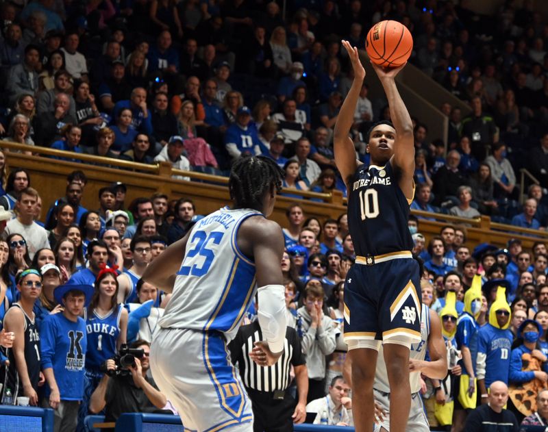 Feb 14, 2023; Durham, North Carolina, USA;  Notre Dame Fighting Irish guard Marcus Hammond (10) shoots in front of Duke Blue Devils forward Mark Mitchell (25) during the first half at Cameron Indoor Stadium. Mandatory Credit: Rob Kinnan-USA TODAY Sports