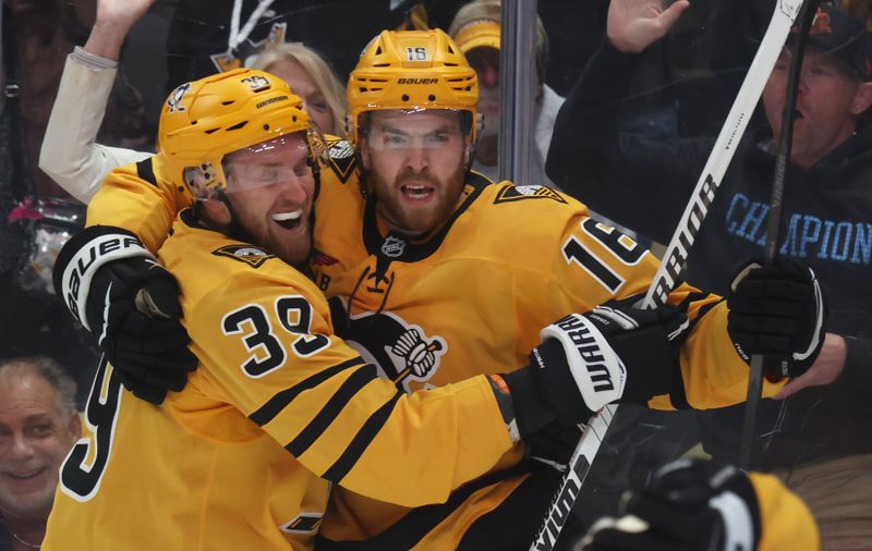 Oct 9, 2025; Pittsburgh, Pennsylvania, USA;  Pittsburgh Penguins right wing Anthony Mantha (39) congratulates right wing Justin Brazeau (16) on his goal against the New York Islanders during the third period at PPG Paints Arena. Mandatory Credit: Charles LeClaire-Imagn Images