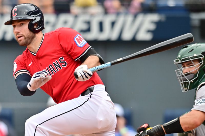 Jul 20, 2025; Cleveland, Ohio, USA; Cleveland Guardians designated hitter David Fry (6) hits an RBI double during the fourth inning against the Athletics at Progressive Field. Mandatory Credit: Ken Blaze-Imagn Images