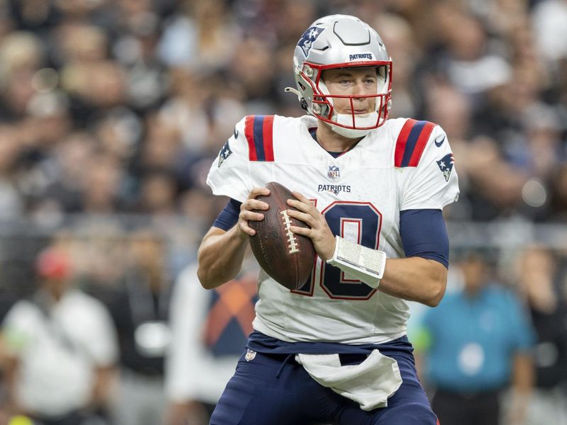 New England Patriots quarterback Mac Jones (10) drops back to pass against the Las Vegas Raiders in an NFL football game, Sunday, Oct. 15, 2023, in Las Vegas, NV. Raiders won 21-17. (AP Photo/Jeff Lewis)