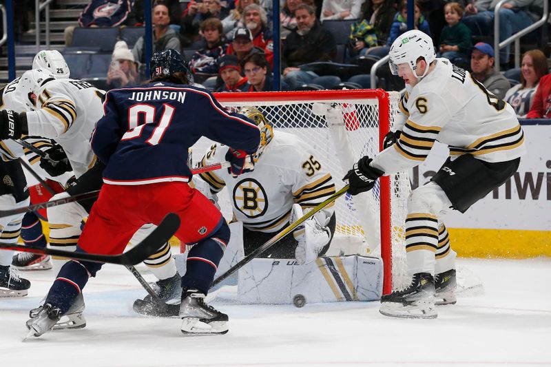 Jan 2, 2024; Columbus, Ohio, USA; Columbus Blue Jackets left wing Kent Johnson (91) looks for a rebound of a Boston Bruins goalie Linus Ullmark (35) save during the third period at Nationwide Arena. Mandatory Credit: Russell LaBounty-USA TODAY Sports