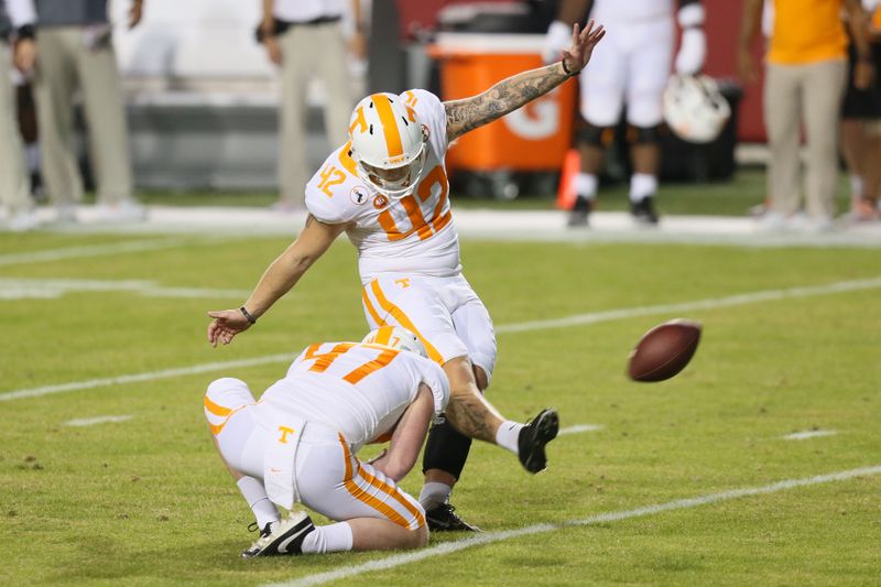 Nov 7, 2020; Fayetteville, Arkansas, USA; Tennessee Volunteers kicker Brent Cimaglia (42) kicks an extra point in the second wearer against the Arkansas Razorbacks at Donald W. Reynolds Razorback Stadium. Mandatory Credit: Nelson Chenault-USA TODAY Sports