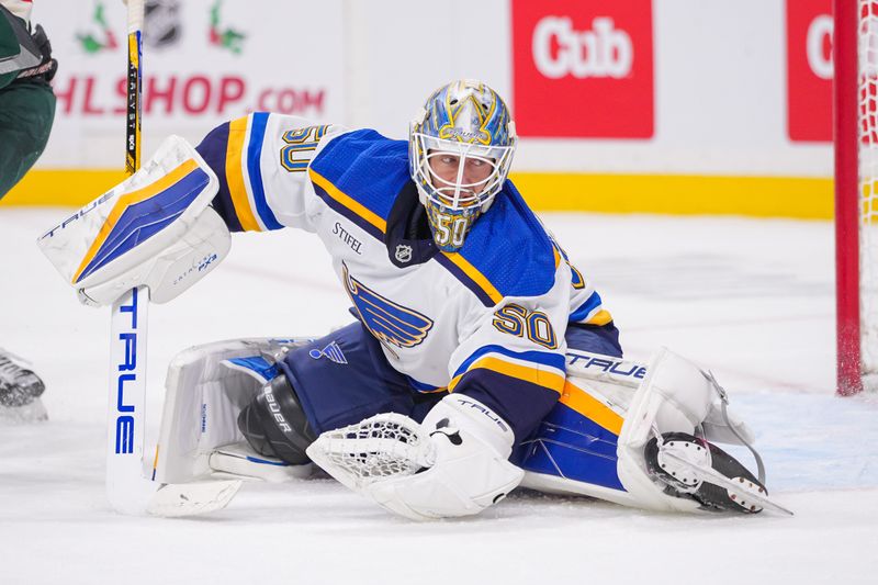 Nov 28, 2023; Saint Paul, Minnesota, USA; St. Louis Blues goaltender Jordan Binnington (50) makes a save against the Minnesota Wild in the second period at Xcel Energy Center. Mandatory Credit: Brad Rempel-USA TODAY Sports