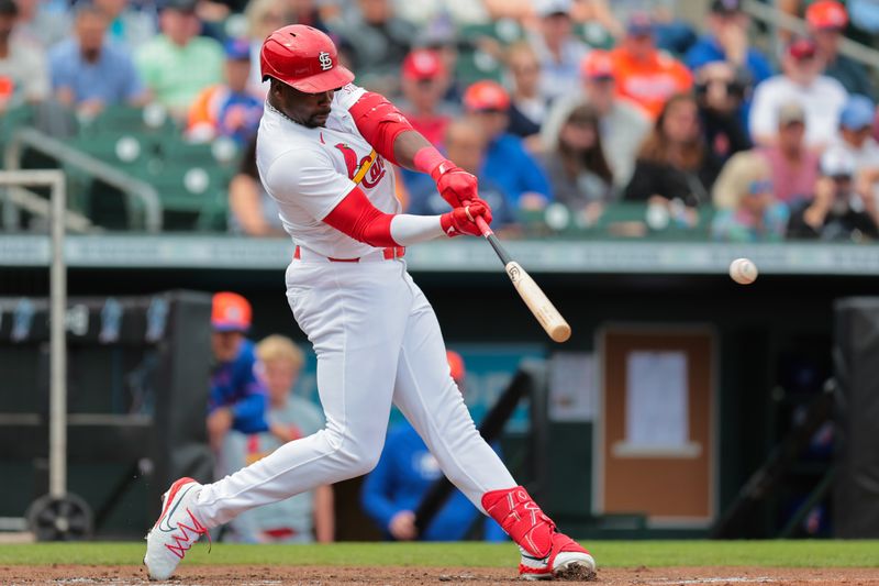 Feb 24, 2025; Jupiter, Florida, USA; Louis Cardinals outfielder Jordan Walker (18) hits a single against the New York Mets during the second inning at Roger Dean Chevrolet Stadium. Mandatory Credit: Sam Navarro-Imagn Images