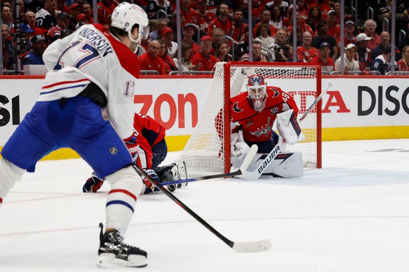 Apr 30, 2025; Washington, District of Columbia, USA; Washington Capitals goaltender Logan Thompson (48) prepares to make a save on Montreal Canadiens right wing Josh Anderson (17) in the second period in game five of the first round of the 2025 Stanley Cup Playoffs at Capital One Arena. Mandatory Credit: Geoff Burke-Imagn Images