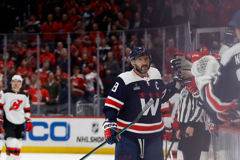 Feb 20, 2024; Washington, District of Columbia, USA; Washington Capitals left wing Alex Ovechkin (8) celebrates with teammates after scoring a goal against the New Jersey Devils in the third period at Capital One Arena. Mandatory Credit: Geoff Burke-USA TODAY Sports