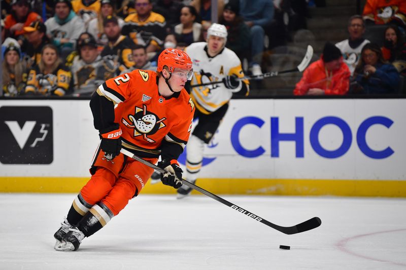 Jan 23, 2025; Anaheim, California, USA; Anaheim Ducks defenseman Jackson LaCombe (2) controls the puck against the Pittsburgh Penguins during the first period at Honda Center. Mandatory Credit: Gary A. Vasquez-Imagn Images