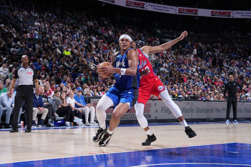 PHILADELPHIA, PA - APRIL 12: Paolo Banchero #5 of the Orlando Magic drives to the basket during the game against the Philadelphia 76ers on April 12, 2024 at the Wells Fargo Center in Philadelphia, Pennsylvania NOTE TO USER: User expressly acknowledges and agrees that, by downloading and/or using this Photograph, user is consenting to the terms and conditions of the Getty Images License Agreement. Mandatory Copyright Notice: Copyright 2024 NBAE (Photo by Jesse D. Garrabrant/NBAE via Getty Images)