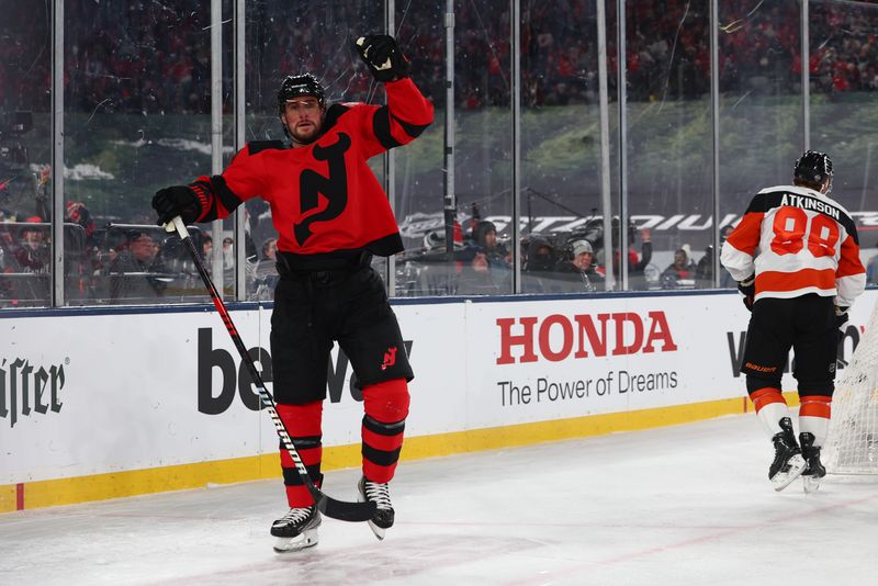 Feb 17, 2024; East Rutherford, New Jersey, USA; New Jersey Devils defenseman Brendan Smith (2) celebrates his goal against the Philadelphia Flyers during the second period in a Stadium Series ice hockey game at MetLife Stadium. Mandatory Credit: Ed Mulholland-USA TODAY Sports