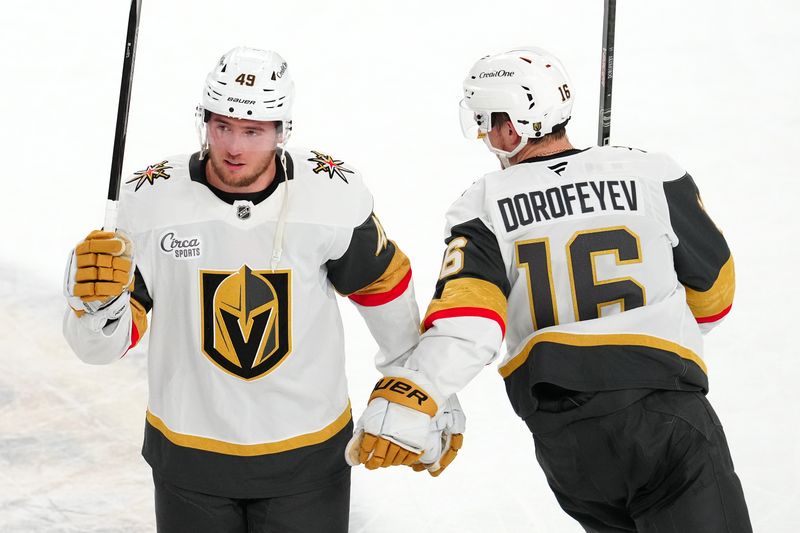 Oct 25, 2024; Las Vegas, Nevada, USA; Vegas Golden Knights center Ivan Barbashev (49) celebrates with Vegas Golden Knights left wing Pavel Dorofeyev (16) after the Golden Knights defeated the Ottawa Senators 6-4 at T-Mobile Arena. Mandatory Credit: Stephen R. Sylvanie-Imagn Images