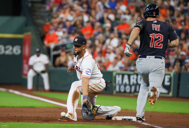 Aug 2, 2023; Houston, Texas, USA; Cleveland Guardians first baseman David Fry (12) is forced out at first base as Houston Astros first baseman Jose Abreu (79) scoops the throw in the second inning at Minute Maid Park. Mandatory Credit: Thomas Shea-USA TODAY Sports