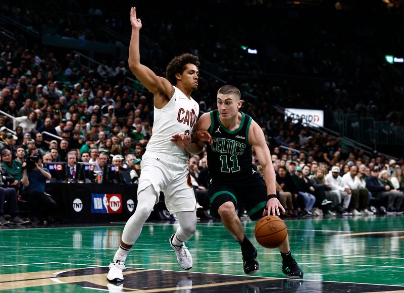 BOSTON, MASSACHUSETTS - NOVEMBER 19: Payton Pritchard #11 of the Boston Celtics drives against Craig Porter Jr. #9 of the Cleveland Cavaliers during the first quarter of the Emirates NBA Cup at TD Garden on November 19, 2024 in Boston, Massachusetts. NOTE TO USER: User expressly acknowledges and agrees that, by downloading and or using this photograph, User is consenting to the terms and conditions of the Getty Images License Agreement.  (Photo by Winslow Townson/Getty Images)