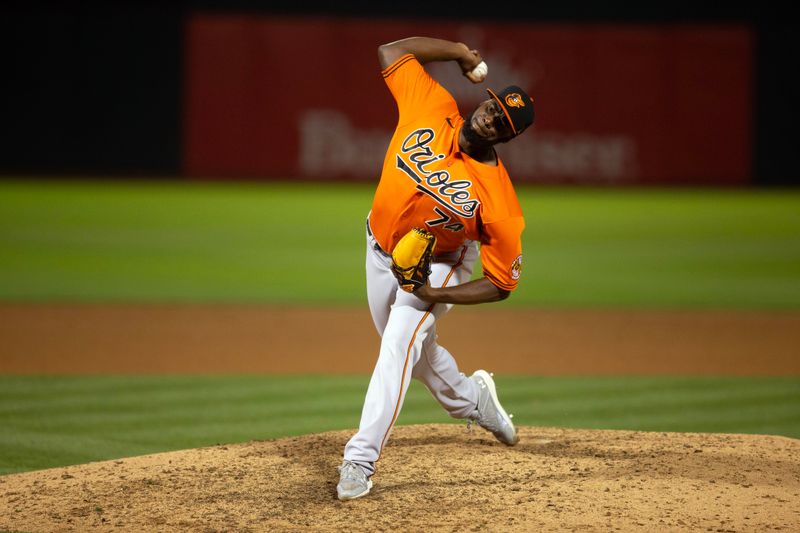 Aug 19, 2023; Oakland, California, USA; Baltimore Orioles pitcher F  lix Bautista (74) pitches against the Oakland Athletics during the ninth inning at Oakland-Alameda County Coliseum. Mandatory Credit: D. Ross Cameron-USA TODAY Sports