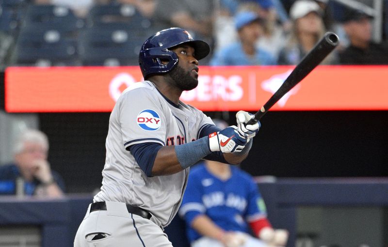 Jul 2, 2024; Toronto, Ontario, CAN;  Houston Astros left fielder Yordan Alvarez (44) hits a three run home run against the Toronto Blue Jays in the fifth inning at Rogers Centre. Mandatory Credit: Dan Hamilton-USA TODAY Sports