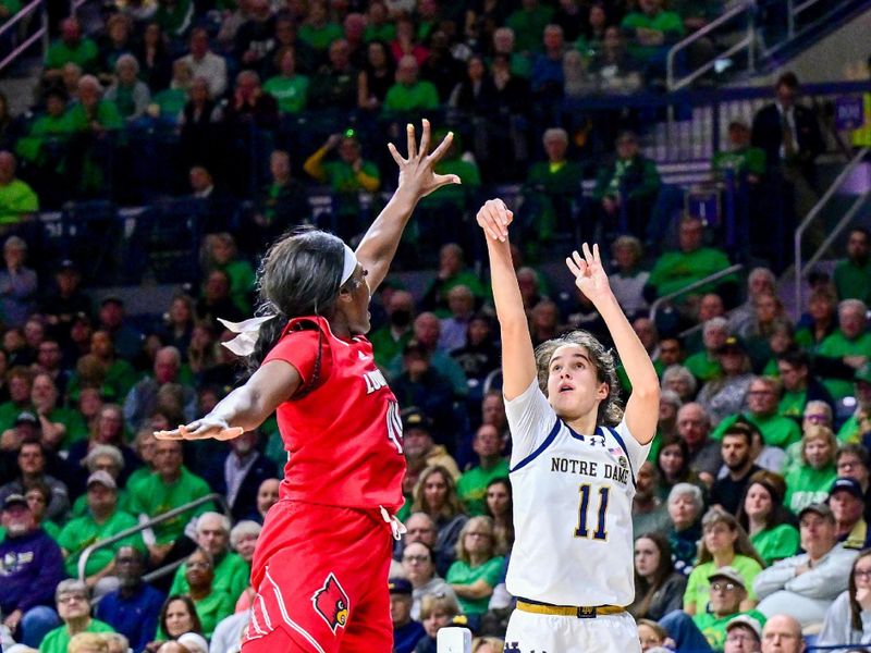 Mar 3, 2024; South Bend, Indiana, USA; Notre Dame Fighting Irish guard Sonia Citron (11) attempts a three point basket as Louisville Cardinals forward Olivia Cochran (44) defends in the second half at the Purcell Pavilion. Mandatory Credit: Matt Cashore-USA TODAY Sports