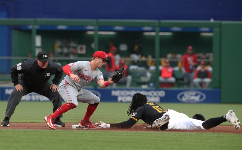 May 20, 2025; Pittsburgh, Pennsylvania, USA; Pittsburgh Pirates center fielder Oneil Cruz (15) steals second base as Cincinnati Reds second baseman Matt McLain (9) takes a late throw during the first inning at PNC Park. Mandatory Credit: Charles LeClaire-Imagn Images