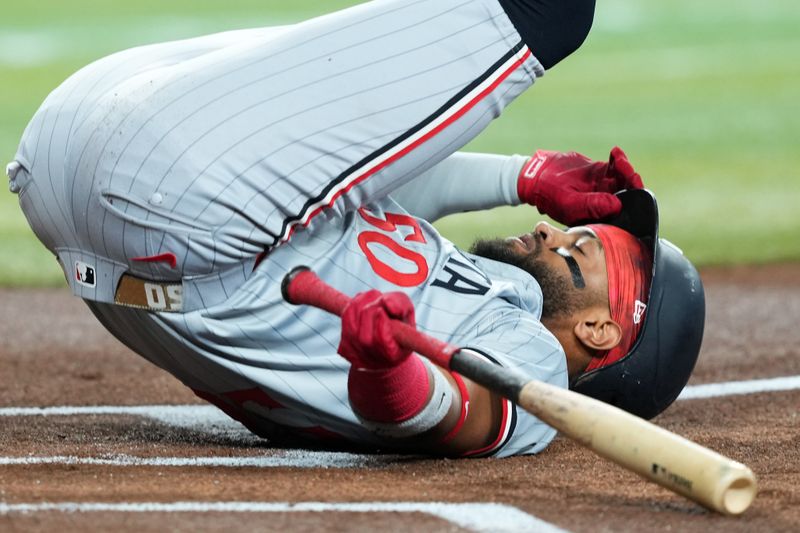 Jun 26, 2024; Phoenix, Arizona, USA; Minnesota Twins shortstop Willi Castro (50) hits the first while avoiding a pitch against the Arizona Diamondbacks during the first inning at Chase Field. Mandatory Credit: Joe Camporeale-USA TODAY Sports