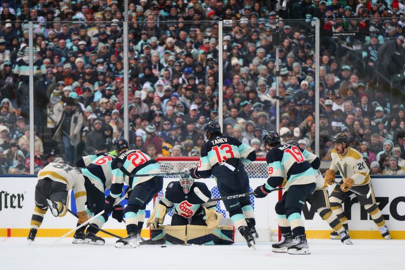 Jan 1, 2024; Seattle, Washington, USA; Seattle Kraken goaltender Joey Daccord (35) blocks a shot against the Vegas Golden Knights during the second period in the 2024 Winter Classic ice hockey game at T-Mobile Park. Mandatory Credit: Steven Bisig-USA TODAY Sports