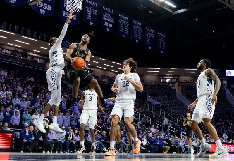 Jan 14, 2026; Manhattan, Kansas, USA; UCF Knights guard Themus Fulks (1) shoots against the Kansas State Wildcats during the first half at Bramlage Coliseum. Mandatory Credit: Jay Biggerstaff-Imagn Images