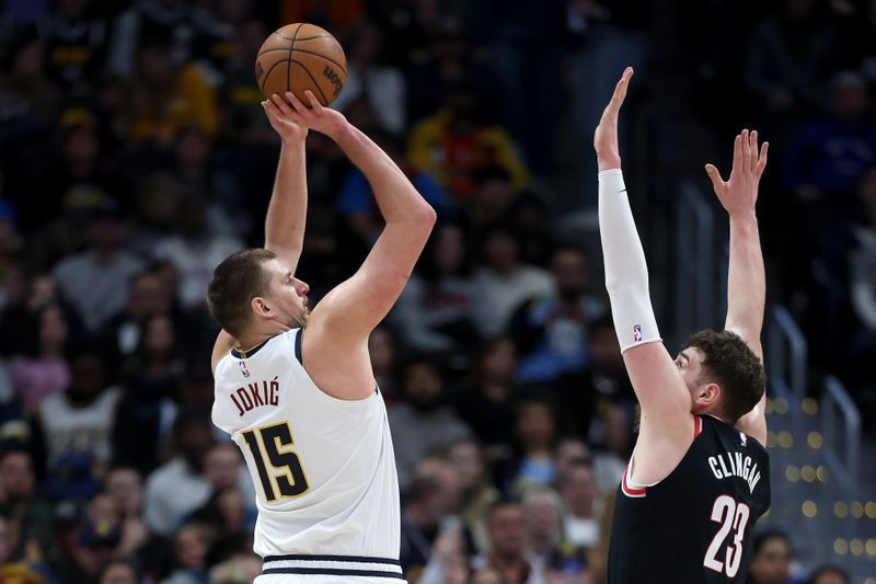 DENVER, COLORADO - FEBRUARY 10: Nikola Jokic #15 of the Denver Nuggets puts up a shot against Donovan Clingan #23 of the Portland Trail Blazers in the third quarter at Ball Arena on February 10, 2025 in Denver, Colorado. NOTE TO USER: User expressly acknowledges and agrees that, by downloading and or using this photograph, User is consenting to the terms and conditions of the Getty Images License Agreement.  (Photo by Matthew Stockman/Getty Images)