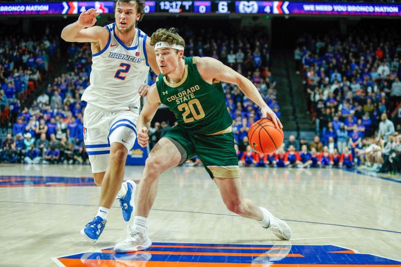 Jan 9, 2024; Boise, Idaho, USA; Colorado State Rams guard Joe Palmer (20) drives past Boise State Broncos forward Tyson Degenhart (2) during the first half at ExtraMile Arena. Mandatory Credit: Brian Losness-USA TODAY Sports