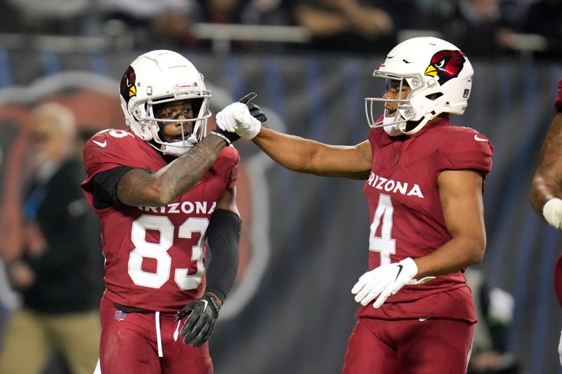 Arizona Cardinals wide receiver Greg Dortch (83) and wide receiver Rondale Moore celebrate Dortch's touchdown during the second half of an NFL football game against the Chicago Bears Sunday, Dec. 24, 2023, in Chicago. (AP Photo/Erin Hooley)