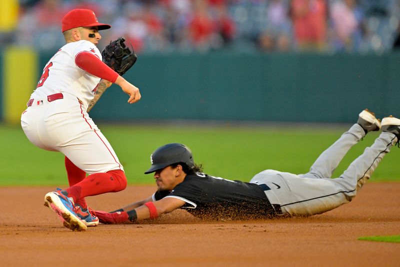 Sep 17, 2024; Anaheim, California, USA;  Chicago White Sox shortstop Nicky Lopez (8) is caught stealing by Los Angeles Angels shortstop Zach Neto (9) in the first inning at Angel Stadium. Mandatory Credit: Jayne Kamin-Oncea-Imagn Images