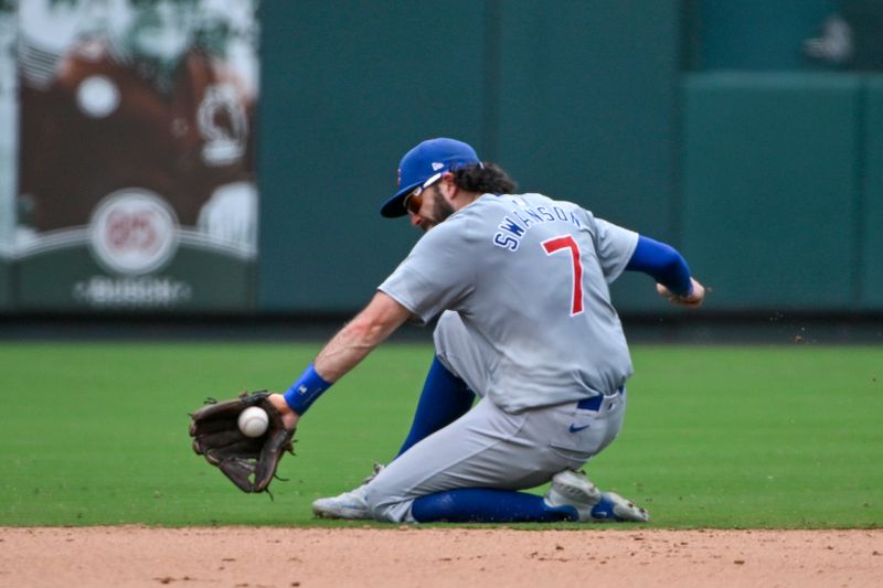 Jul 14, 2024; St. Louis, Missouri, USA;  Chicago Cubs shortstop Dansby Swanson (7) fields a ground ball against the St. Louis Cardinals during the seventh inning at Busch Stadium. Mandatory Credit: Jeff Curry-USA TODAY Sports